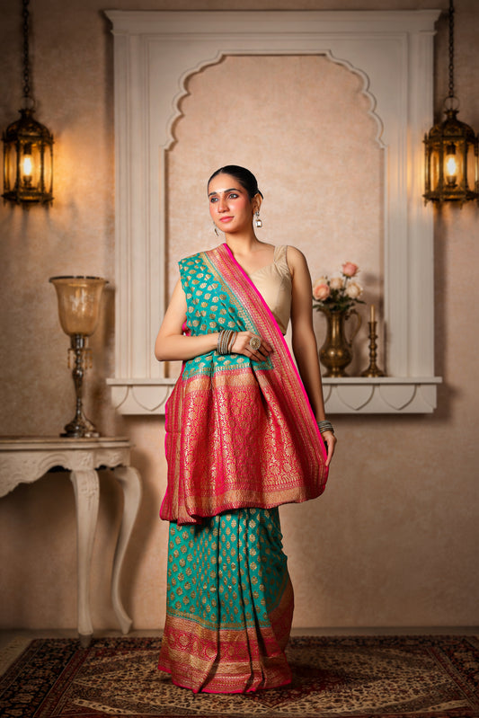 Khaddi Silk Georgette Copper Zari Banarasi Saree – Teal & Magenta Border